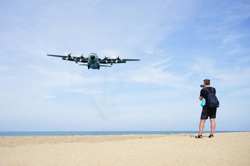  Extreme Landing aircraft above the beautiful Mai khao beach near  Phuket Airport. Watching planes landing with a beautiful beach as a background. Excellent photo playground for tourist.