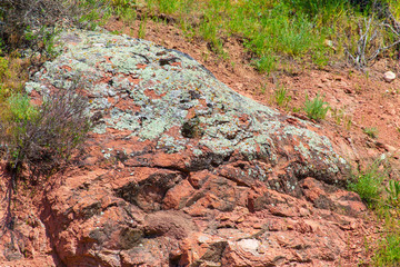 Stone rock in the mountains as a background