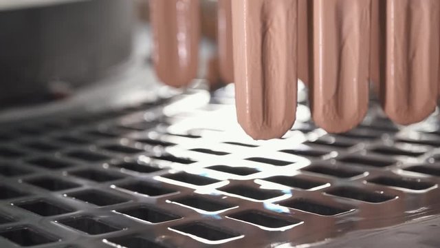 ice cream production, glaze coating process on ice cream, production line, dairy products.