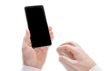 Unrecognizable man holding smartphone with black blank screen isolated on white background. The concept of modern technology electronic device.