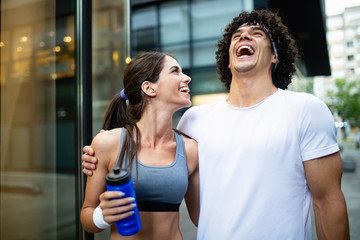Portrait of young attractive happy fitness couple