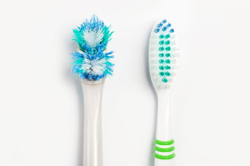 The old toothbrush and new toothbrush isolated on a white background.