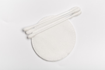 Top view of cotton pads and buds isolated on white