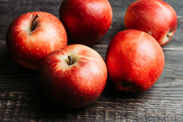 Close-up apples on the rustic wooden background. Selective focus. Shallow depth of field. 