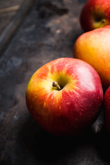 Close-up apples on the rustic wooden background. Selective focus. Shallow depth of field. 