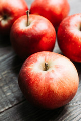 Close-up apples on the rustic wooden background. Selective focus. Shallow depth of field. 