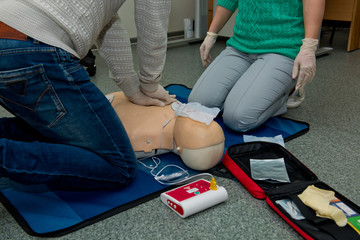 First aid cardiopulmonary resuscitation course using automated external defibrillator device, AED.