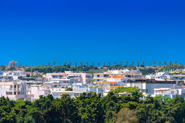 Fototapeta premium The new city of Rhodes developed high on the Monte Smith and near the Acropolis. From the Isiodou street, marked by tall palm trees, you have the most breathtaking view over the Rhodes island.