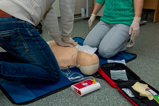 First aid cardiopulmonary resuscitation course using automated external defibrillator device, AED.
