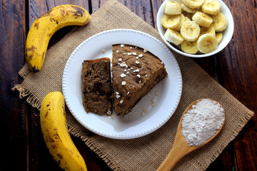Healthy homemade banana cake made with oatmeal on rustic wooden table. sugar-free, milk-free, gluten-free