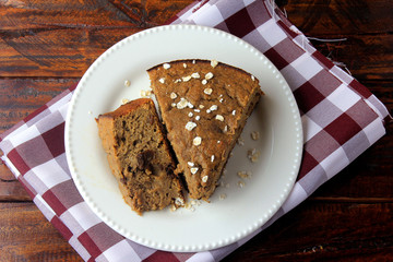 Healthy homemade banana cake made with oatmeal on rustic wooden table. sugar-free, milk-free, gluten-free
