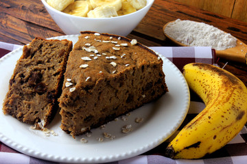 Healthy homemade banana cake made with oatmeal on rustic wooden table. sugar-free, milk-free, gluten-free
