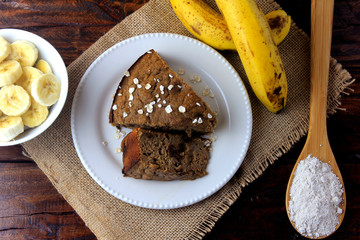 Healthy homemade banana cake made with oatmeal on rustic wooden table. sugar-free, milk-free, gluten-free