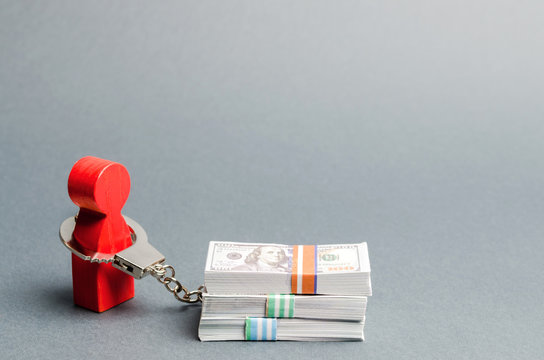 A red man is handcuffed to a money. Dependence on finance. Accumulated debts. Inability to repay loans. Unconscionable terms of the contract. Ban debtors from leaving the country. Unconscionability
