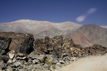 View from dirt road on dry barren mountain range in Atacama desert, Chile