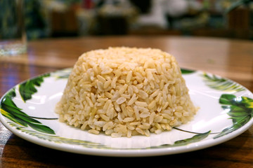 Front View of Steamed Thai Brown Rice Served on Wooden Table