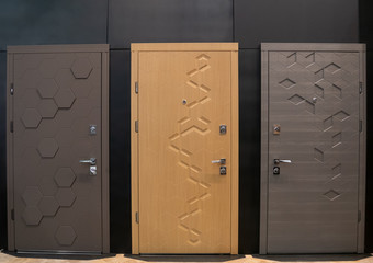 showroom with tree modern entry doors at furniture store