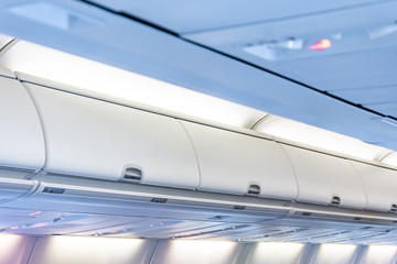 Closed doors luggage shelves in economy class passenger aircraft.