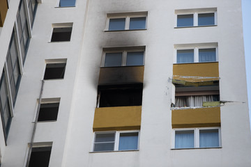 Front and windows of a condominium after an explosion and fire in its apartment.
