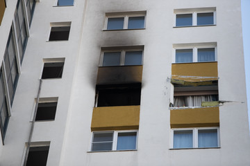 Front and windows of a condominium after an explosion and fire in its apartment.