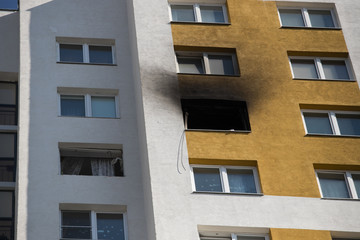 Front and windows of a condominium after an explosion and fire in its apartment.