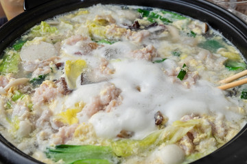 Cooking food in hot pot for make sukiyaki or shabu