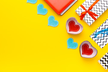 Person holding a present for Saint Valentine's day in his hands. Beautiful colorful background to st. Valentine day. Greeting card with red hearts. Wedding's invitation. Love expression. 