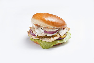 burger with chicken and vegetables on a white background