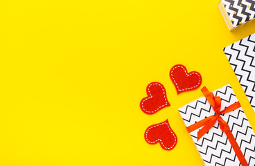 Person holding a present for Saint Valentine's day in his hands. Beautiful colorful background to st. Valentine day. Greeting card with red hearts. Wedding's invitation. Love expression. 