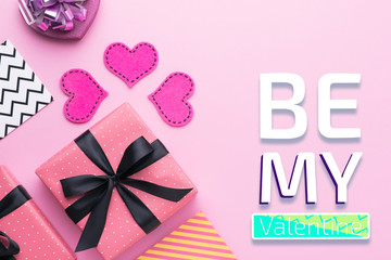 Person holding a present for Saint Valentine's day in his hands. Beautiful colorful background to st. Valentine day. Greeting card with red hearts. Wedding's invitation. Love expression. 