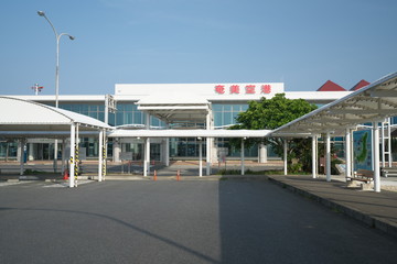 Fototapeta na wymiar Amami Oshima, Japan - April 8, 2019: Amami airport terminal building in Amami Oshima, Kagoshima, Japan