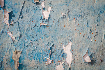 Old wall with dried, damaged very old paint. Texture, background.