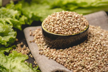 Seeds green buckwheat on a dark background. Vegan nutritious and healthy product. Concept of organic food