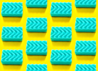 Seamless pattern with blue dishwashing sponges on yellow background