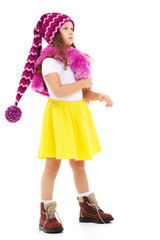 Little girl in a hat and scarf.