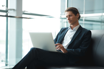 Young handsome businessman conducting negotiations with investors. Electronic business. Alternative payment services. Management of the projects on freelance. Cryptocurrency. Blockchain. Trader.