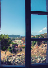 Fototapeta premium View of the city from the window of the building in the fortress of the old bar, Montenegro. Summer.