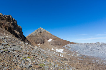 Uri Rotstock mountain summit in Swiss alps, blue sky