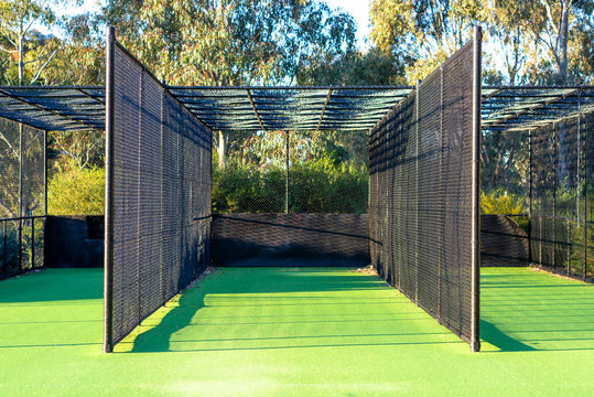 A Cricket Practice Net On Green Grass In Melbourne, Victoria, Australia