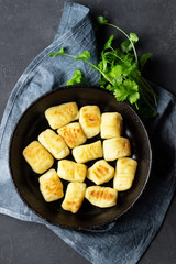 Homemade Potato Gnocchi. Flat lay. Black background.