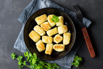 Homemade Potato Gnocchi. Flat lay. Black background.
