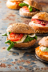 Italian Caprese sandwiches with fresh tomatoes, mozzarella cheese