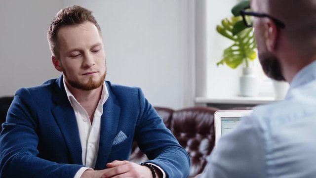 Confident man attending job interview