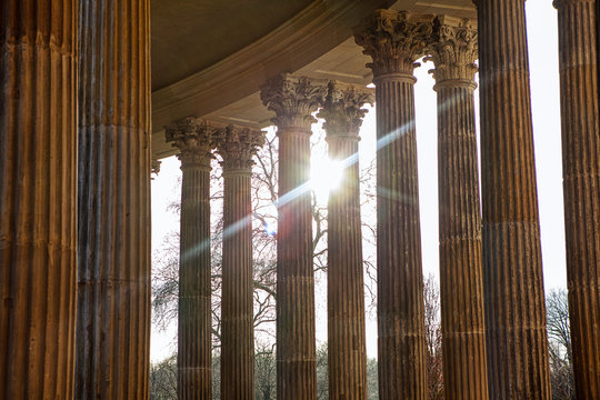 sun shining through ancient columns
