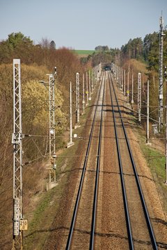 Railway double track electrified track. Railway infrastructure. Sunny weather.
