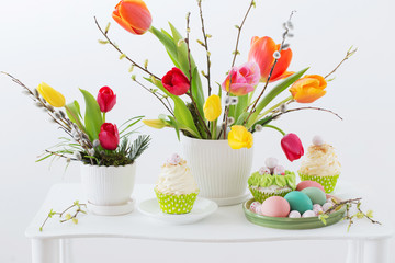 Easter arrangement with tulips and cupcakes