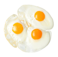 Fried appetizing eggs. White isolated background. Close-up. View from above.