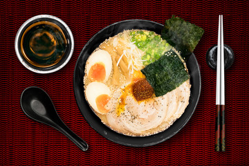 Ramen are Japanese noodles. They consist of wheat noodles served in a pork broth. often flavored with miso, uses toppings such as sliced pork (chasyu), dried seaweed and bamboo shoots ( menma).