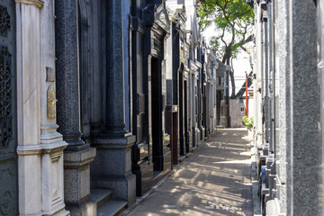 Recoleta cemetery in Buenos Aires narrow passage with shadow