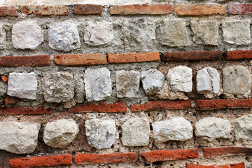 Texture of reds and white bricks ancient roman wall.